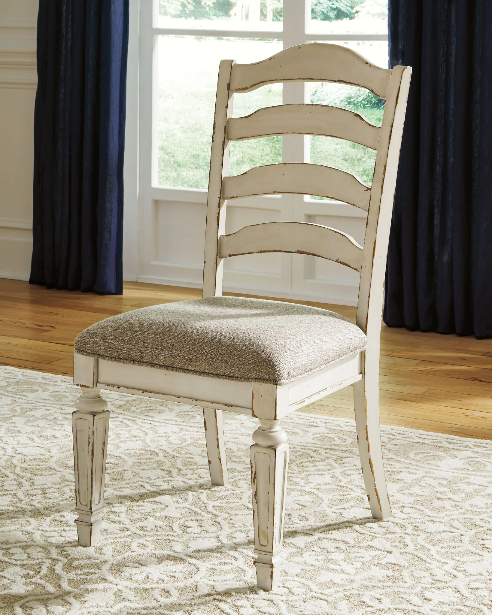 5454-realyn-dining-uph-side-chair-set-of-2-ladderback-chipped-white-11.webp Realyn - Dining UPH Side Chair (Set of 2) - Ladderback - Chipped White