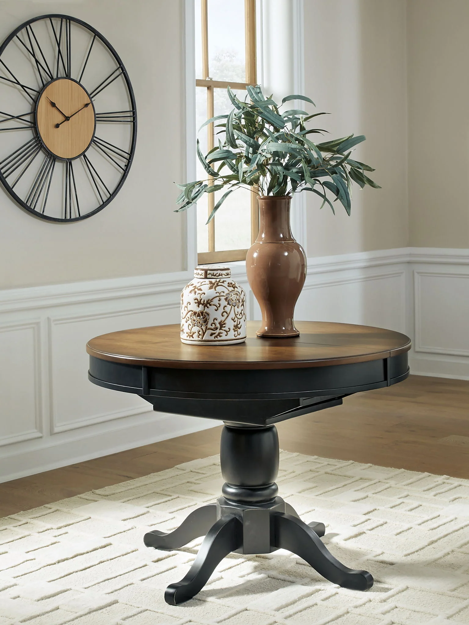 Clorazi - Oval Dining Room Butterfly Extension Table - Black / Brown